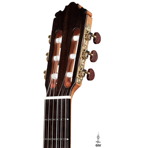 The headstock of a 2023 Sergio Perez "Segovia" model of classical guitar made of spruce and green ebony. 