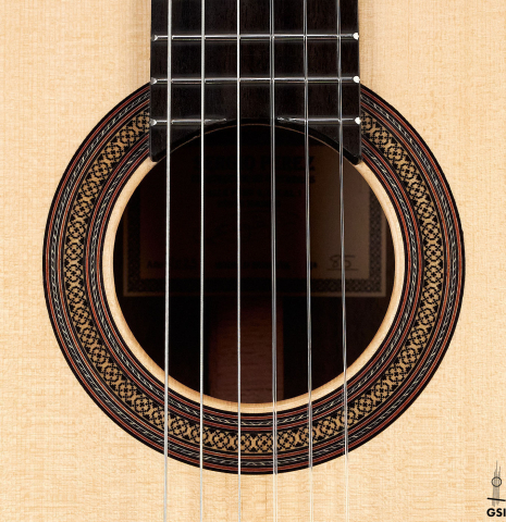 The rosette of a 2023 Sergio Perez "Segovia" model of classical guitar made of spruce and green ebony. 
