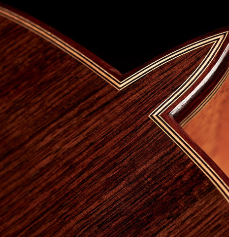 Closeup of the back and heel of a 2023 Teodoro Perez "Antigua" classical guitar made of spruce and Indian rosewood.