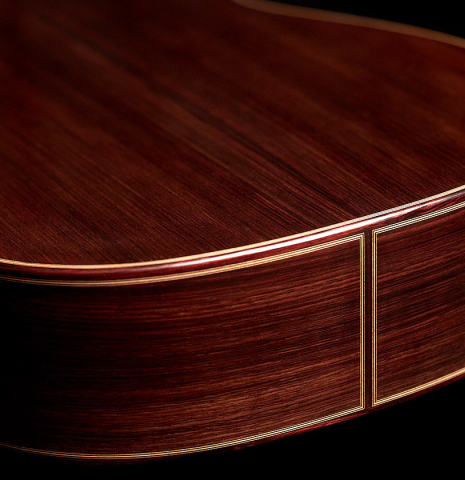 The back and sides at the foot of a 2023 Teodoro Perez "Antigua" classical guitar made of spruce and Indian rosewood.