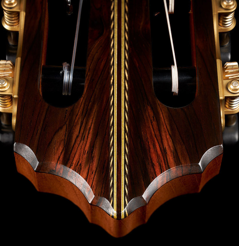 The headstock and tuning machines of a 2023 Erez Perelman classical guitar made of spruce and birdseye maple