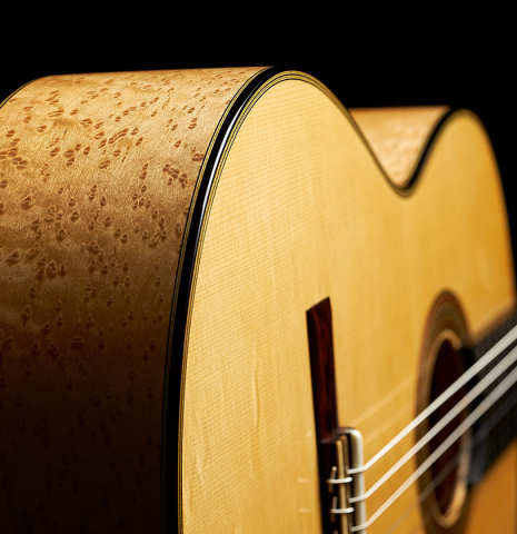 The front and sides of a 2023 Erez Perelman classical guitar made of spruce and birdseye maple