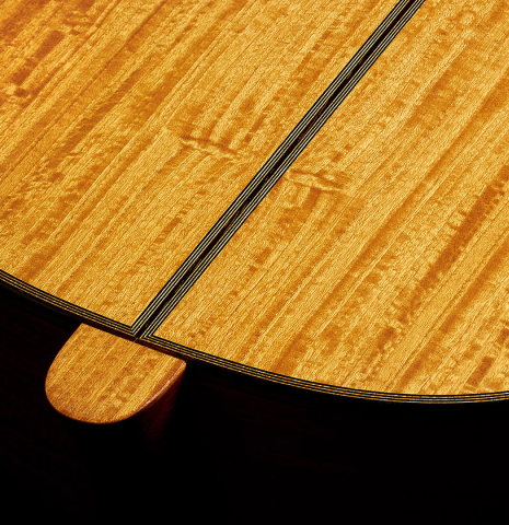 The heel and back center seam of a 2007 Daryl Perry "Simplicio" classical guitar made with spruce and satinwood