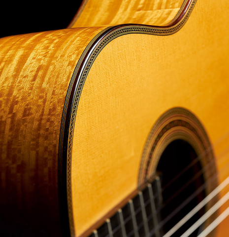 The top and side of a 2007 Daryl Perry "Simplicio" classical guitar made with spruce and satinwood
