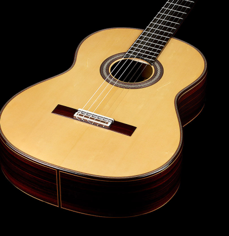The top of a 2024 Sergio Perez "Segovia" classical guitar made of spruce and Indian rosewood.