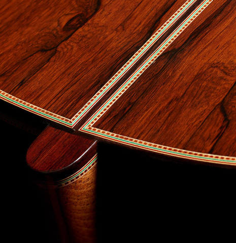 The heel, back binding and purfling of a 2024 Teodoro Perez "1884 Torres - La Emperatriz" classical guitar made of spruce and African rosewood