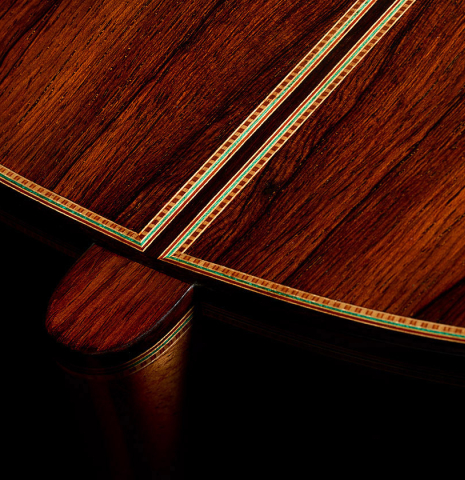 The heel, back binding and purfling of a 2025 Teodoro Perez "1884 Torres - La Emperatriz" classical guitar made of spruce and African rosewood