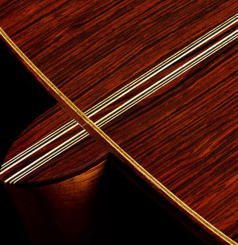 The heel, back binding and purflings of a 2000 Daryl Perry classical guitar made of spruce and CSA rosewood