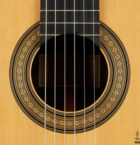 The rosette of a 2000 Daryl Perry classical guitar made of spruce and CSA rosewood