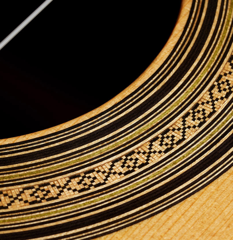 Detailed closeup of the rosette of a 2000 Daryl Perry classical guitar made of spruce and CSA rosewood