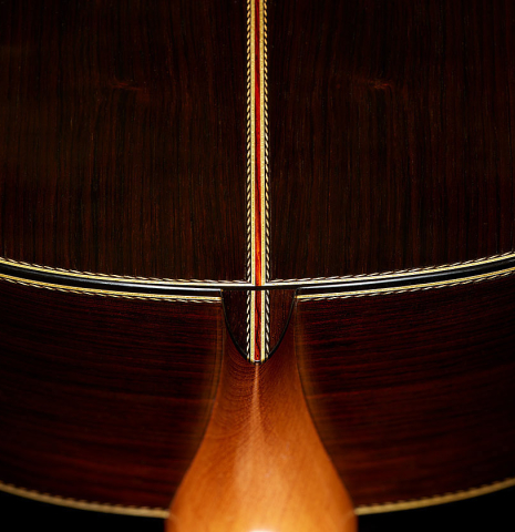 The heel, back binding and purfling of a 2025 Erez Perelman classical guitar made of cedar and CSA rosewood