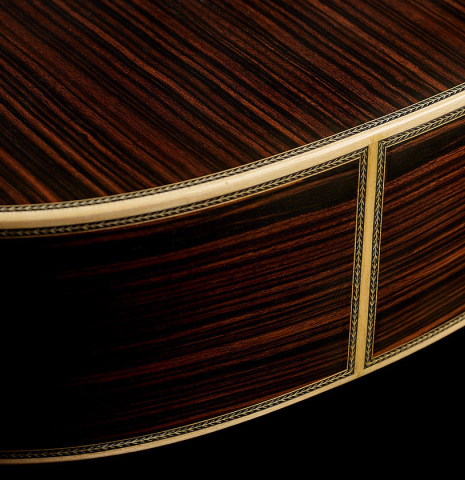 The sides at the foot of a 2025 Teodoro Perez "Especial" classical guitar made of spruce and Makassar ebony