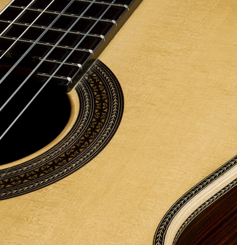 The soundboard and rosette of a 2025 Teodoro Perez "Especial" classical guitar made of spruce and Makassar ebony