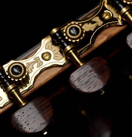 The side of the headstock and tuning machines of a 2026 Sergio Perez "Segovia" classical guitar made of cedar and Indian rosewood