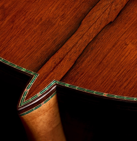The heel, back binding and purfling of a 2026 Teodoro Perez "60th Anniversary" classical guitar made of cedar and African rosewood