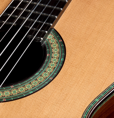 The soundboard and rosette detail of a 2026 Teodoro Perez "60th Anniversary" classical guitar made of cedar and African rosewood