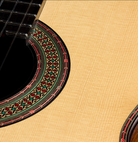 The soundboard and rosette detail of a 2026 Teodoro Perez "60th Anniversary" classical guitar made of spruce and pau ferro