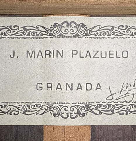 The label of a 1999 Jose Marin Plazuelo "Bouchet" classical guitar made of spruce and CSA rosewood