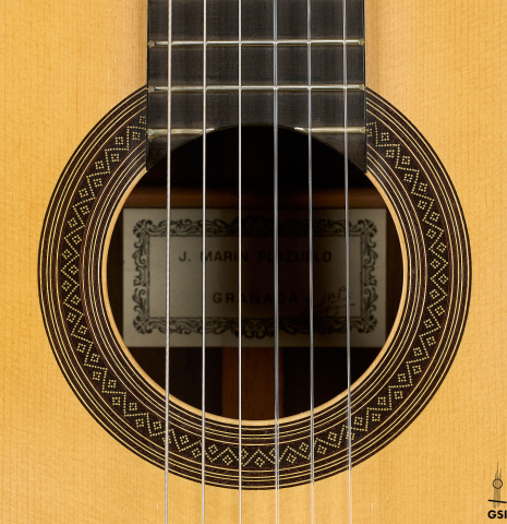 The rosette of a 1999 Jose Marin Plazuelo "Bouchet" classical guitar made of spruce and CSA rosewood