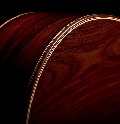 The back binding and purfling of a 2005 Jose Marin Plazuelo "Bouchet" classical guitar made of spruce and CSA rosewood