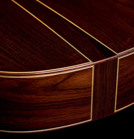 The sides at the foot with central wedge of a 2005 Jose Marin Plazuelo "Bouchet" classical guitar made of spruce and CSA rosewood