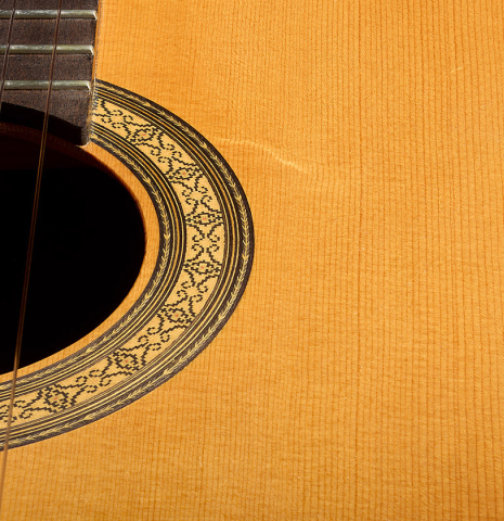 The soundboard and rosette of a 1987 Richard Prenkert classical guitar made of spruce and CSA rosewood