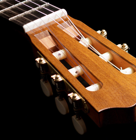 The headstock of a 2022 Jake Fuller "Purnell" classical guitar made of spruce and Honduran rosewood