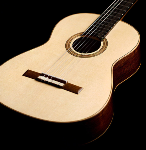 The soundboard of a 2022 Jake Fuller "Purnell" classical guitar made of spruce and Honduran rosewood