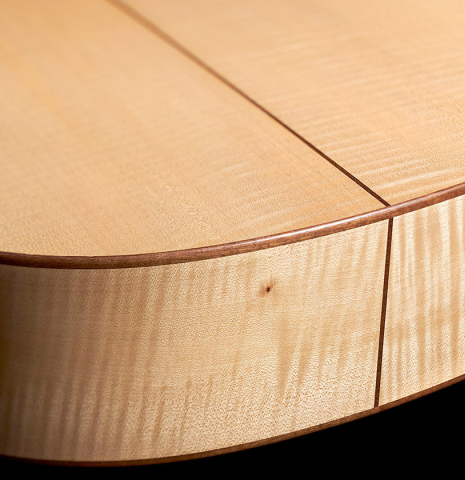 The lower bout of a 2023 Jake Fuller "Purnell" classical guitar made with spruce and maple.