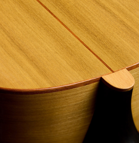 The heel, back binding and purfling of a 2023 Jake Fuller "Purnell" w/pegs "Torres" classical guitar made of spruce and tulipwood