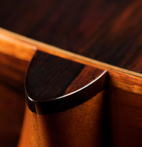 The heel of a 2009 Fabio Ragghianti classical guitar made of spruce and CSA rosewood