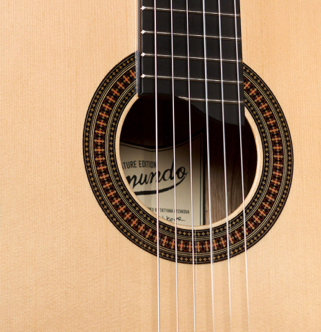 The soundboard of a 2022 Raimundo Signature Edition “Tatyana Ryzhkova Black Limba” classical guitar made with spruce top