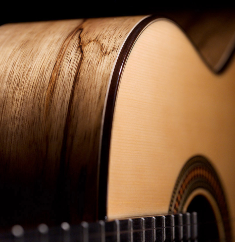 The front and side of a 2022 Raimundo Signature Edition “Tatyana Ryzhkova Black Limba” classical guitar made with spruce top