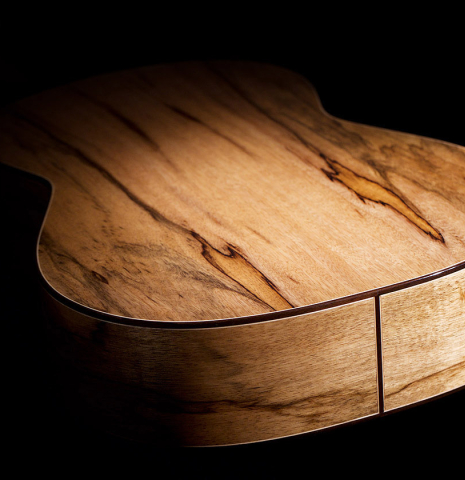 The back and sides of a 2022 Raimundo Signature Edition “Tatyana Ryzhkova Black Limba” classical guitar made with spruce top