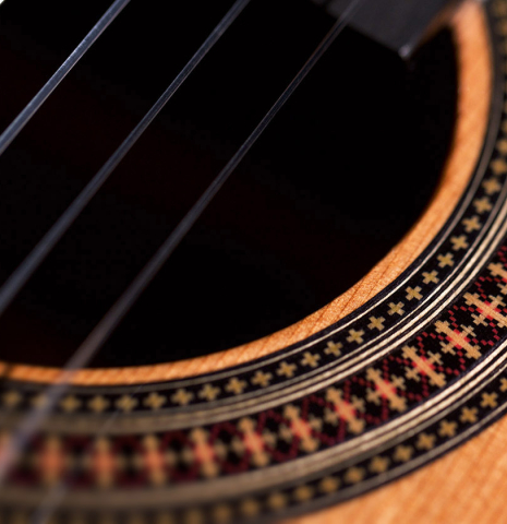 The rosette of a 2022 Raimundo Signature Edition “Tatyana Ryzhkova Black Limba” classical guitar made with cedar top The rosette of a 2022 Raimundo Signature Edition “Tatyana Ryzhkova Black Limba” classical guitar made with cedar top