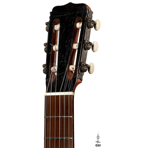 The headstock of a 1910 Jose Ramirez I classical guitar made of spruce and mahogany