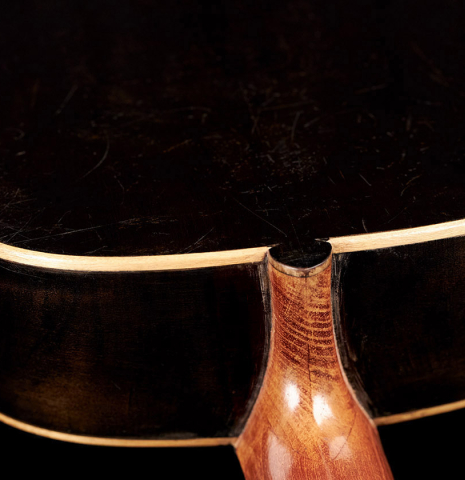The back and heel of a 1910 Jose Ramirez I classical guitar made of spruce and mahogany