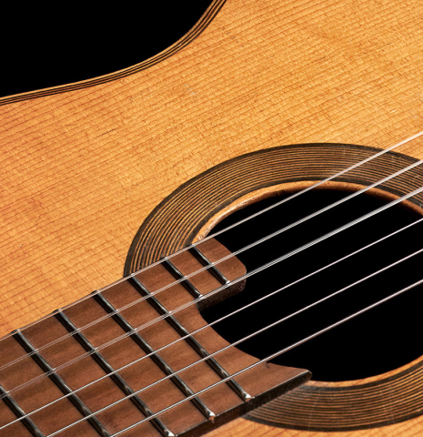 The fretboard and rosette of a 1910 Jose Ramirez I classical guitar made of spruce and mahogany