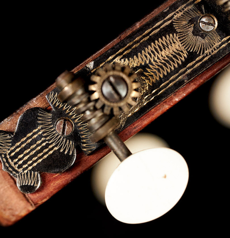 The machine heads of a 1910 Jose Ramirez I classical guitar made of spruce and mahogany