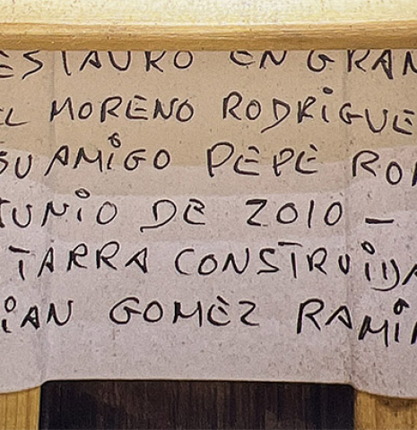 The repair label of a 1913 Jose Ramirez I (Romero collection) made of spruce and CSA rosewood