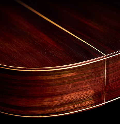 The lower bout of a 1912 Manuel Ramirez classical guitar made of spruce and CSA rosewood