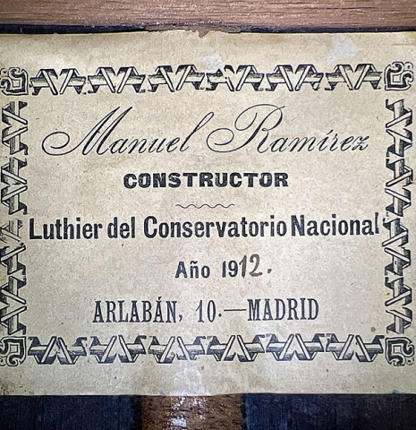 The label of a 1912 Manuel Ramirez classical guitar made of spruce and CSA rosewood