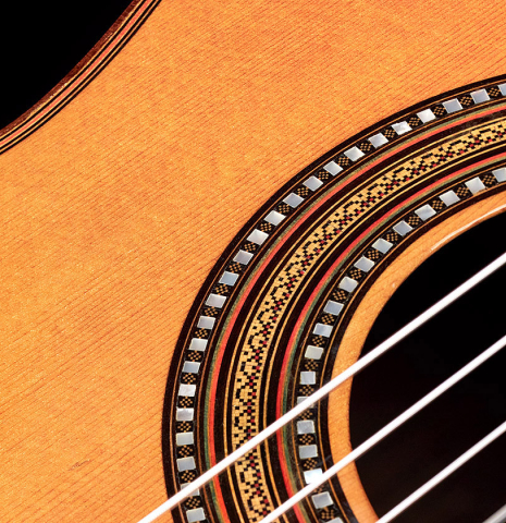 The rosette of a 1912 Manuel Ramirez classical guitar made of spruce and CSA rosewood