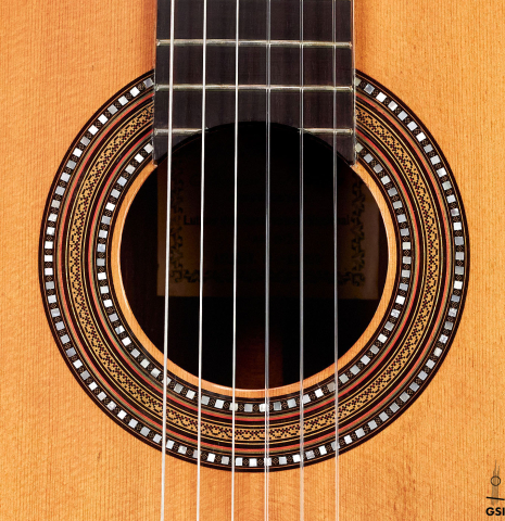 The rosette of a 1912 Manuel Ramirez classical guitar made of spruce and CSA rosewood
