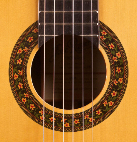 This is the rosette of a Jose Ramirez "130 Anos" classical guitar built in 2014. It has a spruce soundboard and Indian rosewood back and sides.