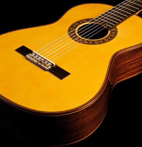 This is the front view showing top and sides of a Jose Ramirez "130 Anos" classical guitar built in 2014. It has a spruce soundboard and Indian rosewood back and sides.