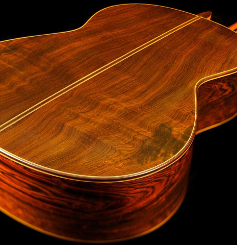 The back and sides at the foot of a 2004 Jose Ramirez "1a" classical guitar made of cedar and CSA rosewood