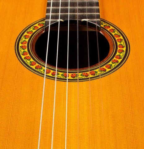 Closeup of the rosette of a 2004 Jose Ramirez "1a" classical guitar made of cedar and CSA rosewood