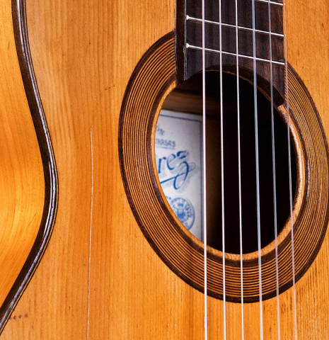 The soundboard and rosette of a 1945 Jose Ramirez II classical guitar made of spruce and cypress