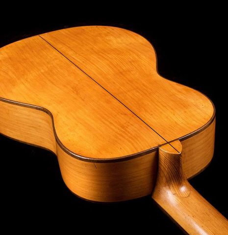 The back and neck of a 1945 Jose Ramirez II classical guitar made of spruce and cypress
